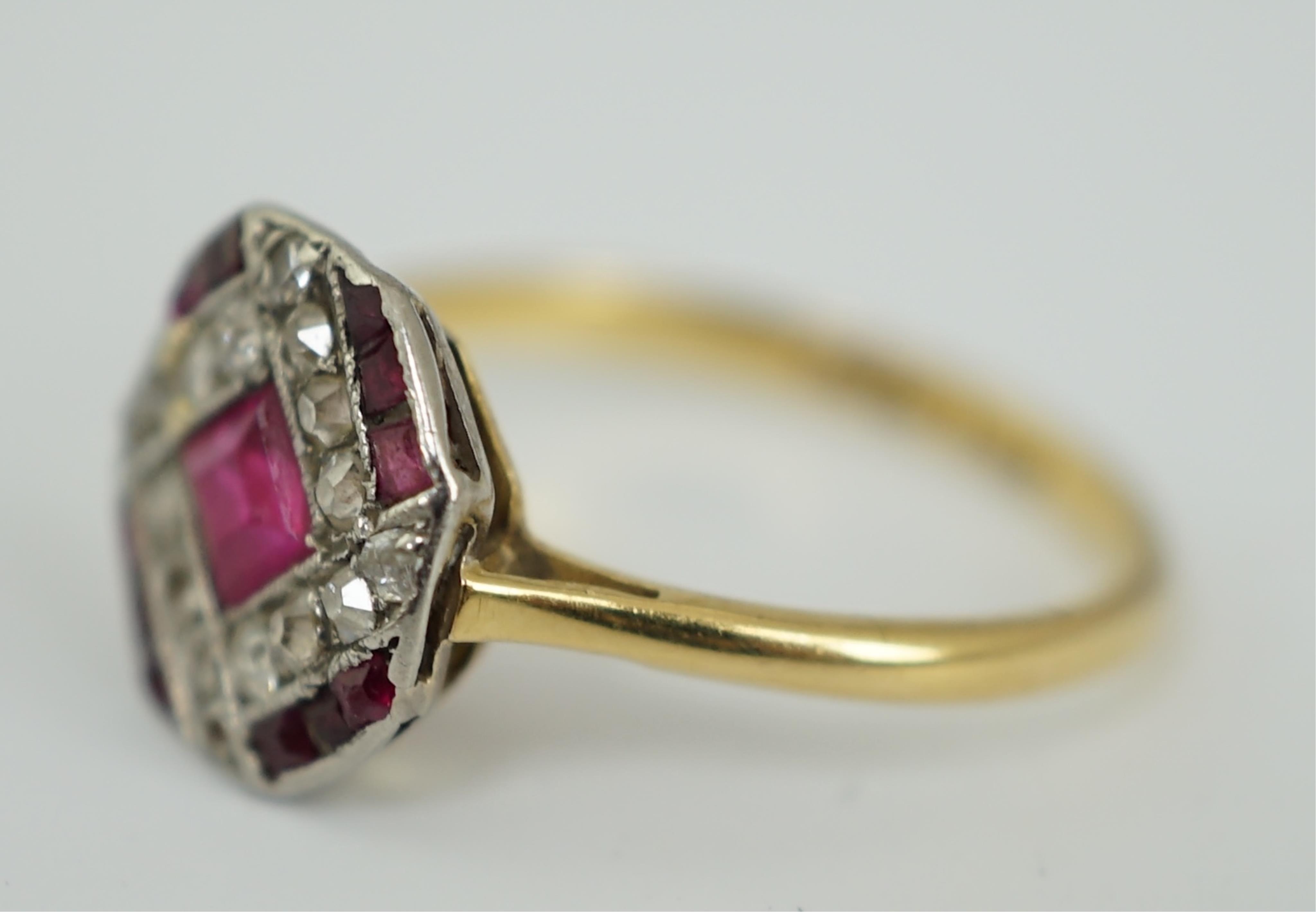 An Art Deco 18ct and platinum, ruby and diamond set octagonal cluster ring